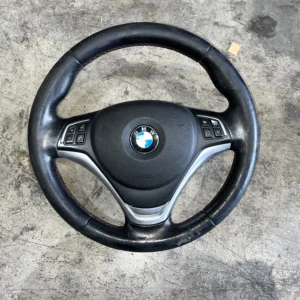 ΓΝΗΣΙΟ ΔΕΡΜΑΤΙΝΟ ΤΙΜΟΝΙ ΠΟΛΛΑΠΛΩΝ ΛΕΙΤΟΥΡΓΙΩΝ BMW X1 E84 - ΑΡΙΣΤΗ ΚΑΤΑΣΤΑΣΗ